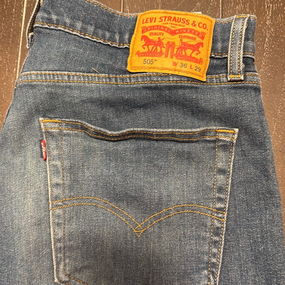 Levi 505 36x29. Regular.   Dark wash. Low stretch.